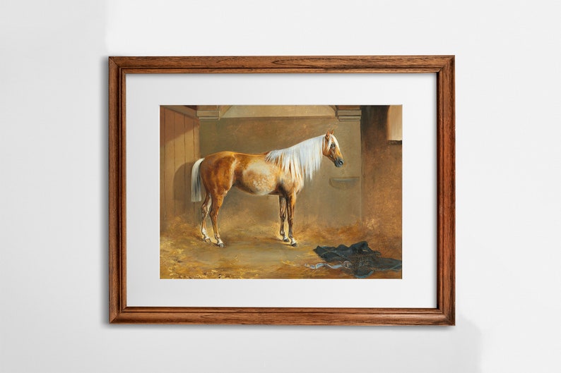 May include: A painting of a light brown horse with a white mane and tail standing in a stable. The horse is facing to the right and has its head slightly lowered. The stable is dimly lit and has a straw-covered floor.