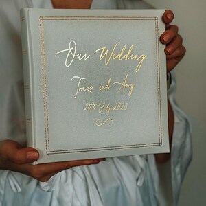 Large wedding album for 200 photos slip in, size of the photos is 4 x 6 inch, 10 x 15 cm. Personalised white album with gold cover lining and matching text colour personalisation. Add names and wedding date on the cover.