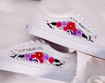 May include: White canvas low-top sneakers with embroidered bats, flowers, and the text "4.11.25" and "Jaiden."