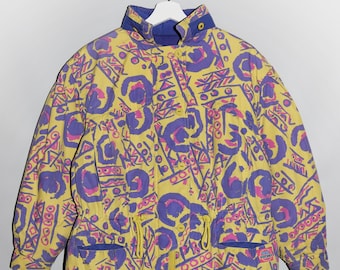 May include: A yellow, purple and pink patterned jacket with a blue lining and a drawstring waist.