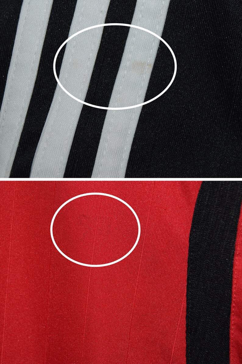 May include: Close-up of black and white striped fabric with a white stripe in the center. The fabric is smooth and has a slight sheen. Below the fabric is a close-up of red fabric with a black stripe on the right side. The fabric is smooth and has a slight sheen.