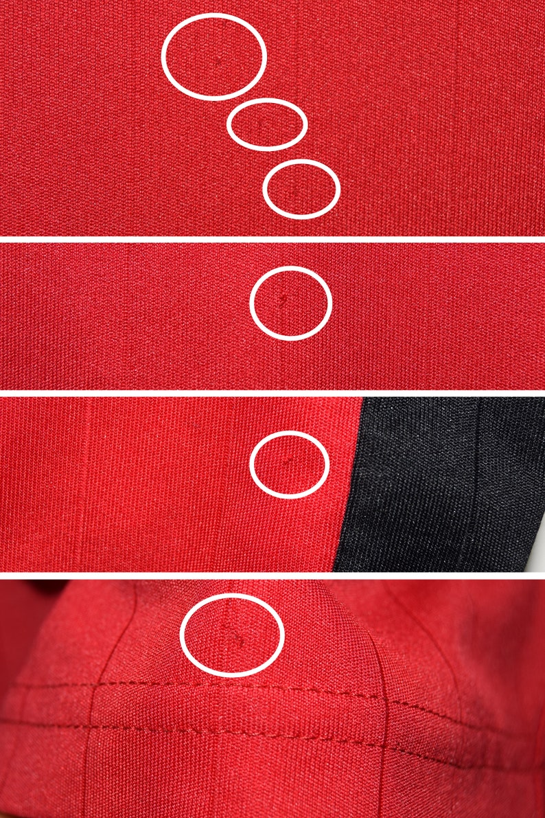 May include: Close-up of a red fabric with five small holes. The fabric has a textured, woven appearance. The holes are circled in white.