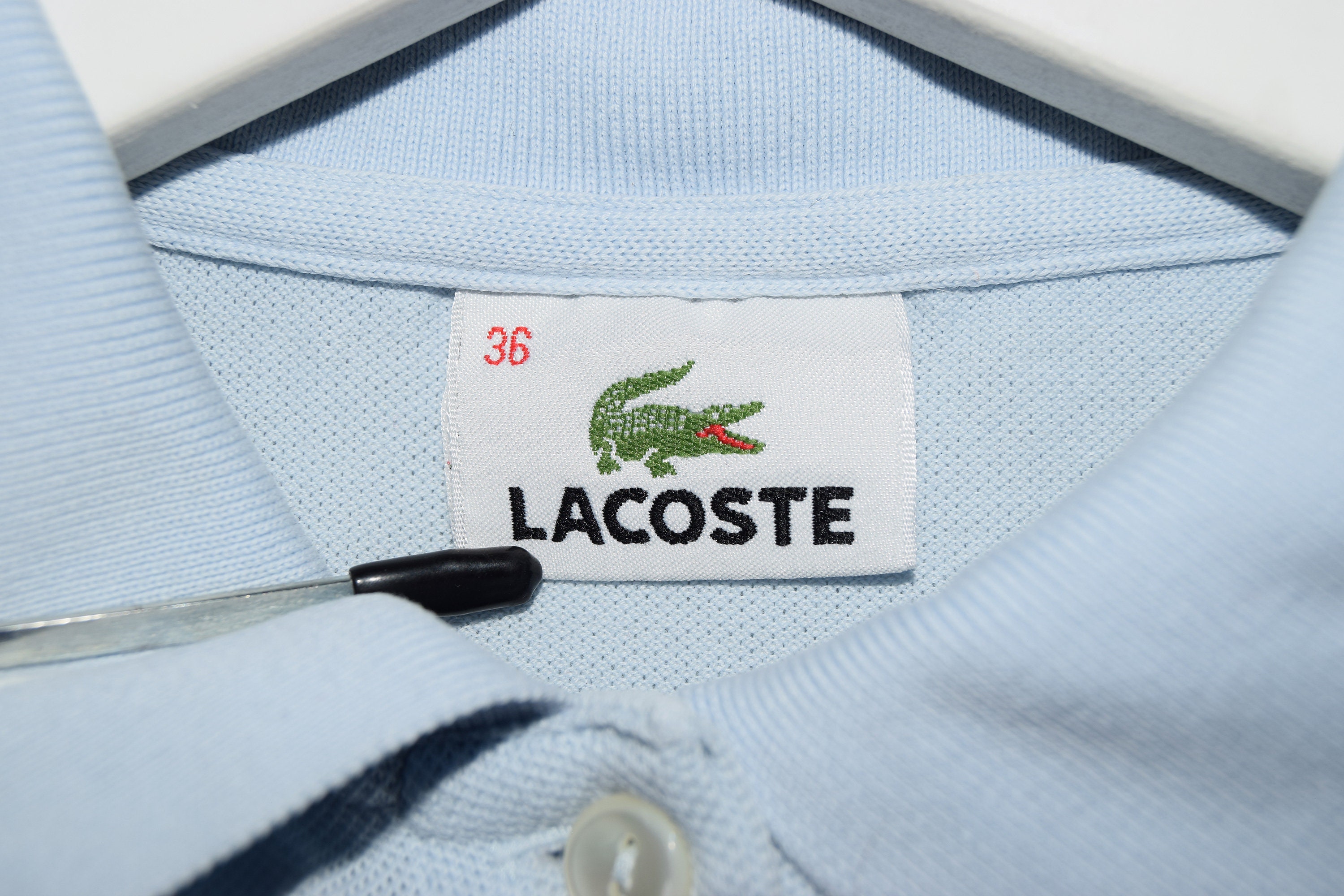 Etiquette pull lacoste sale