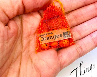 6 Mini Orangen in einer transparenten Netztasche