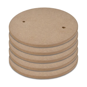 May include: A stack of six round, unfinished wood circles with two holes in each circle.