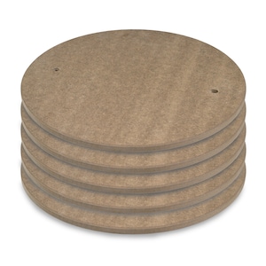 May include: A stack of five round, brown, wooden discs with holes in the center. The discs are stacked on top of each other.