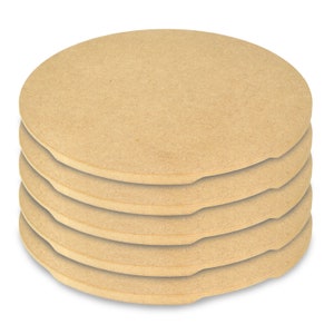 May include: A stack of five round, light brown pizza stones. Each stone has a curved indentation on one side. The stones are made of a porous material and are stacked on a white background.