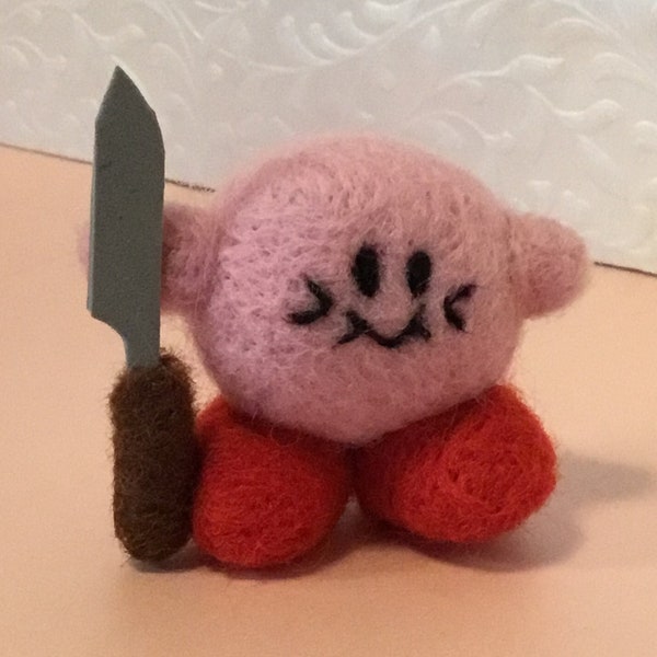 Kirby con una aguja de cuchillo de fieltro