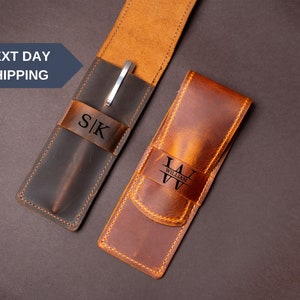 May include: Two brown leather pen cases with a silver pen in one case. The cases are personalized with the initials "S|K" and the name "William".