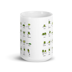 May include: White ceramic mug featuring a whimsical design of green frogs in various yoga poses and activities. The mug includes words like "Yoga", "Stretch", "Funny", and "Dance". A fun and unique gift for frog and yoga enthusiasts.