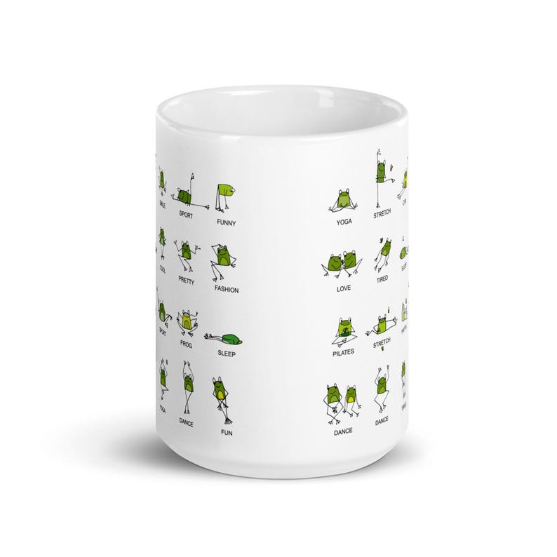 May include: White ceramic mug featuring a whimsical design of green frogs in various yoga poses and activities. The mug includes words like "Yoga", "Stretch", "Funny", and "Dance". A fun and unique gift for frog and yoga enthusiasts.