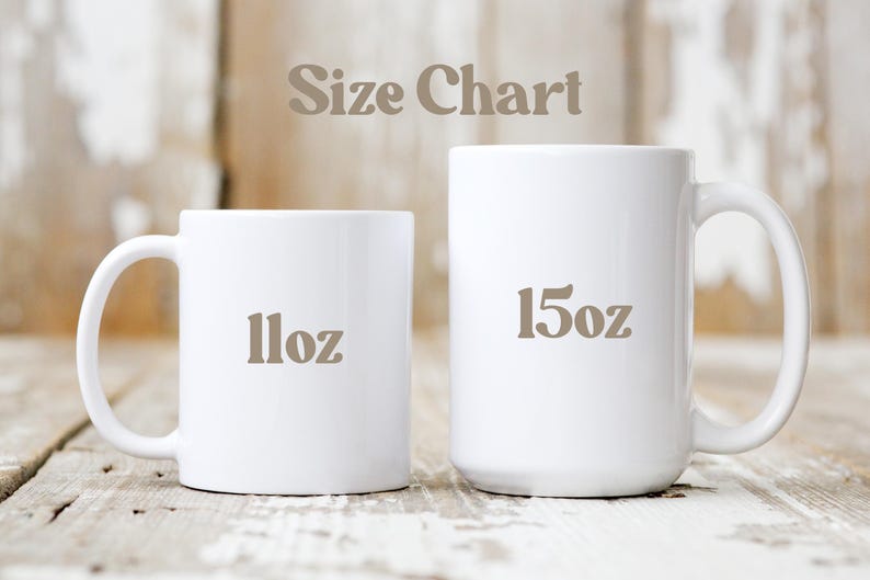 May include: Two white ceramic mugs, one labeled "11oz" and the other "15oz", are displayed against a rustic wooden background. The text "Size Chart" is above the mugs. The mugs are for beverages.
