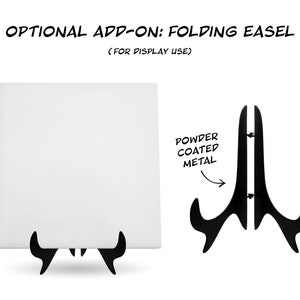 May include: A white canvas with a black folding easel stand. The easel is made of powder coated metal. The text "OPTIONAL ADD-ON: FOLDING EASEL (FOR DISPLAY USE)" is at the top of the image. The text "POWDER COATED METAL" is written next to the easel.