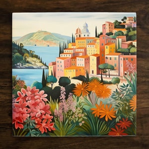 May include: A painting of a colorful Italian village with a blue sea in the background. The village is built on a hillside and has many buildings with red tile roofs. There are flowers in the foreground.