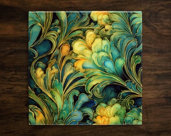 May include: Square decorative tile with a vibrant floral design. The artwork features swirling leaves and flower shapes in shades of teal, green, and yellow, accented with gold outlines. The tile is set against a dark blue background.
