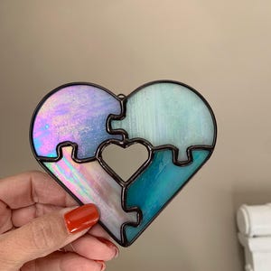 Stained glass puzzle pieces heart sun catcher