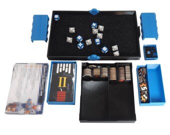 May include: A blue and black game organizer with compartments for dice, tokens, and cards. The organizer has a black felt-lined tray for dice rolling and a compartment labeled "II".