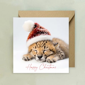 Tarjeta de feliz Navidad con lindo guepardo durmiente