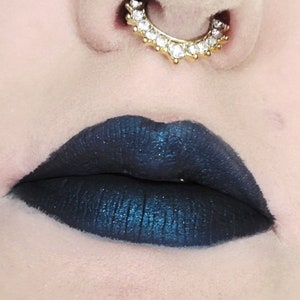 Matte black liquid lipstick with blue metallic flakes, Basic Witch Beauty shade Nevermore - transfer and smudge proof, long wearing