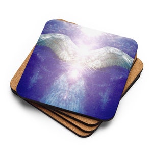 May include: Set of square coasters with a celestial design. The image shows a white winged figure against a blue and purple backdrop. The coasters have a cork backing and are stacked.