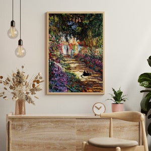 May include: A framed painting of a garden path with a black cat sitting on the path. The path is lined with colorful flowers and trees. The painting is in a wooden frame.