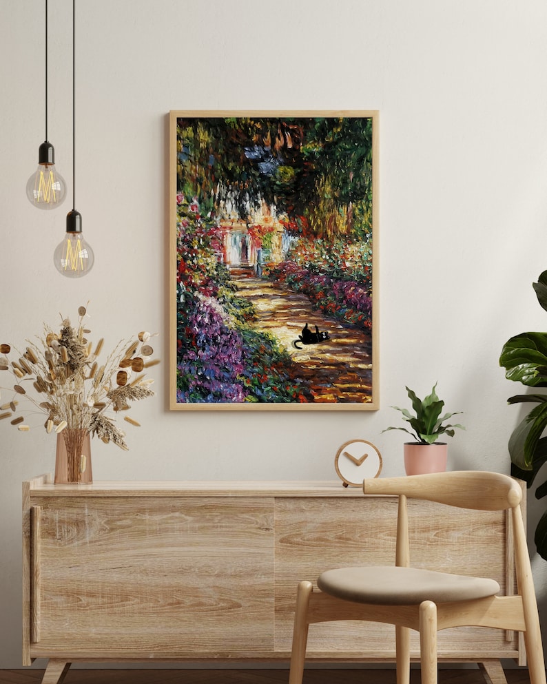 May include: A framed painting of a garden path with a black cat sitting on the path. The path is lined with colorful flowers and trees. The painting is in a wooden frame.