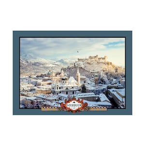 May include: A scenic winter landscape featuring a snow-covered city with a prominent fortress atop a hill. The image is framed with a blue border and includes the text "DJERHOLM" in a decorative emblem at the bottom.