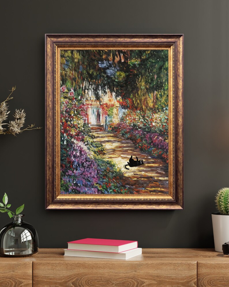 May include: A framed oil painting depicting a garden path lined with vibrant flowers and lush greenery. A black cat is lounging on the path in the foreground.