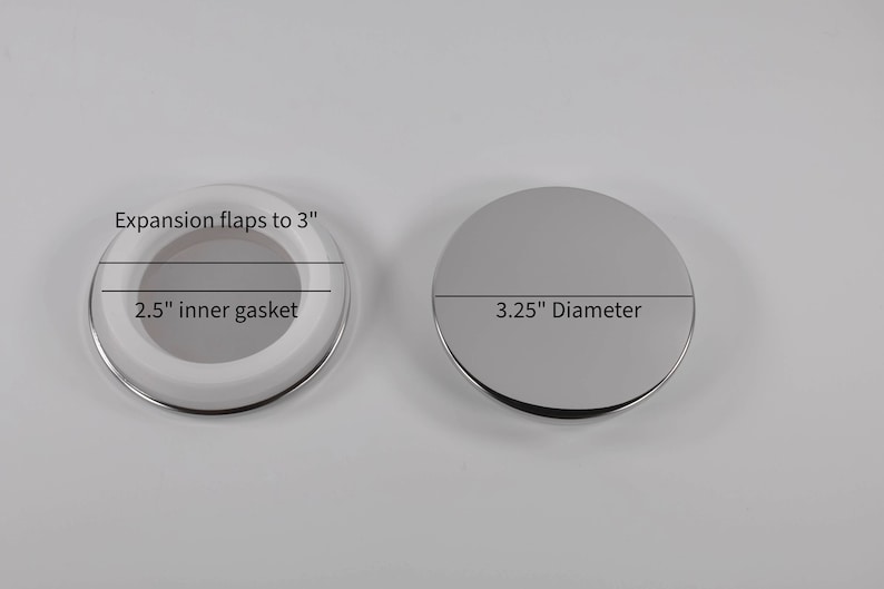 May include: Two round drain covers, one with a white rubber gasket and expansion flaps to 3 inches, and the other with a 3.25 inch diameter.