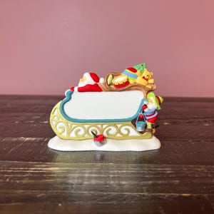 Dept 56: Village Santa&#39;s Sleigh Sign-North Pole Series; Department 56 - RETIRED; Christmas Village Accessories-Christmas Village Scene Decor
