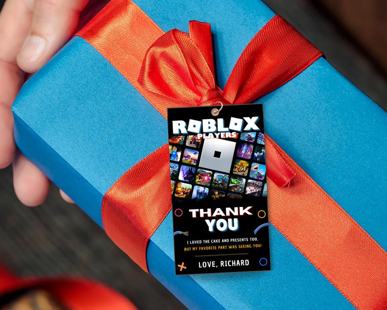 May include: A blue gift box with a red ribbon and a thank you tag that says "ROBLOX PLAYERS" with a Roblox logo and the text "Thank You" and "I loved the cake and presents too, but my favorite part was seeing you! Love, Richard".