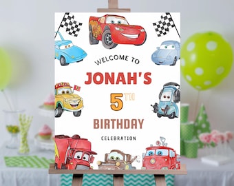 May include: A white welcome sign with a red, yellow, and blue cartoon car theme. The sign says "Welcome to Jonah's 5th Birthday Celebration".