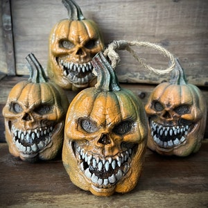 A Single Handmade Jack-O'-Lantern Ornament in Resin