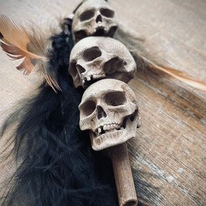 Headhunter’s Tribal Stacked Skulls on a Stake: White with Black Feather