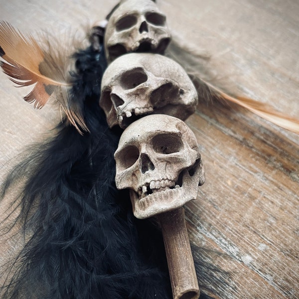Headhunter’s Tribal Stacked Skulls on a Stake: White with Black Feather