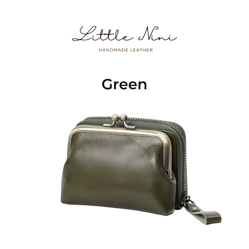 May include: A green leather coin purse with a gold-toned metal frame and zipper closure. The purse has the text "Little Nini Handmade Leather" and "Green" printed on the white background.
