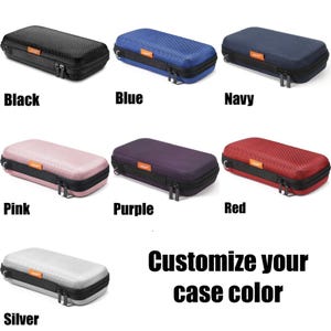May include: A selection of zippered cases in various colors: black, blue, navy, pink, purple, red, and silver. Each case has a black zipper and trim, with the text "Customize your case color" below the cases.