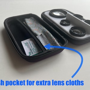 May include: Black zippered case with a mesh pocket containing lens cloths and a small packet. Next to it is a case with multiple camera lenses. The text "Mesh pocket for extra lens cloths" is visible.