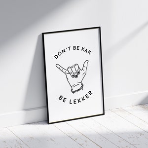 May include: Black and white framed print with the text "DON'T BE KAK BE LEKKER" and a hand gesture.