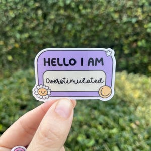 Hello I’m Overstimulated name tag waterproof sticker decal/ mental Health awareness/self love/ Gifts/ decal/kindle/booktok/stanley/stressed
