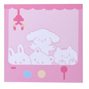 Pode incluir: Bloco de notas rosa com um design de m&aacute;quina de garras com um coelho, um c&atilde;o e um gato brancos. O bloco de notas tem um fundo rosa com contornos brancos dos animais.