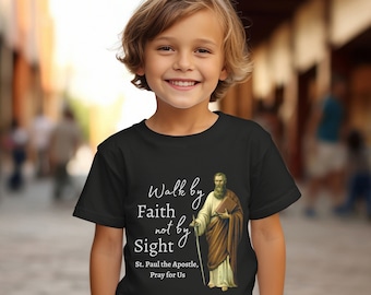 May include: Black t-shirt with a white graphic of a man holding a book and a staff. The text on the shirt reads "Walk by Faith not by Sight. St. Paul the Apostle, Pray for Us."