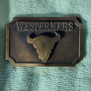 Vintage Westerners brass belt buckle