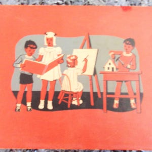 May include: A vintage children's book illustration showing four children engaged in creative activities. A girl in a white dress and a white hat is reading a book to a boy in a blue shirt and red shorts. Another girl in a white dress is painting on a canvas easel. A boy in a red shirt is building a small house at a table.