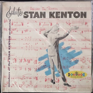 May include: A vintage record album cover featuring a black and white illustration of Stan Kenton conducting an orchestra. The album cover is titled "Salute Stan Kenton" and features the text "Members of the Stan Kenton Orchestra" and "Artist In Rhythm". The album cover is from Crown Records and features the text "Full Color High Fidelity".