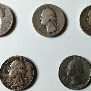 Vintage coin collection consisting of silver dollars, silver nickels, quarters, 50 cent pieces, dimes, wheat pennies and Susan B Anthony&#39;s
