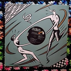 May include: A set of three ceramic mugs with a speckled, matte finish. Each mug features a different color: light blue, cream, and gray. The mugs have a simple, modern design and a comfortable handle. Perfect for coffee or tea.