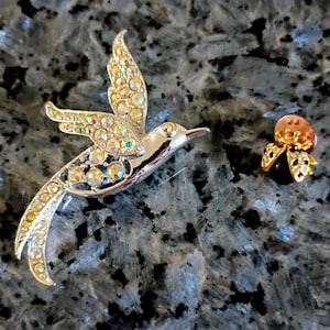 Vintage Sarah Coventry bird of paradise broach and vintage ladybug pin, gold plated with rhinestone and ruby red colored stones