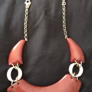 Red Lucite bib necklace by INC extends to 25 inches