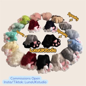 May include: A collection of plush faux fur animal paw gloves in various colors including red, black, blue, green, and white. Each pair features soft pink paw pads and white fur accents. The text Squeaky and LunaUKStudio is visible.